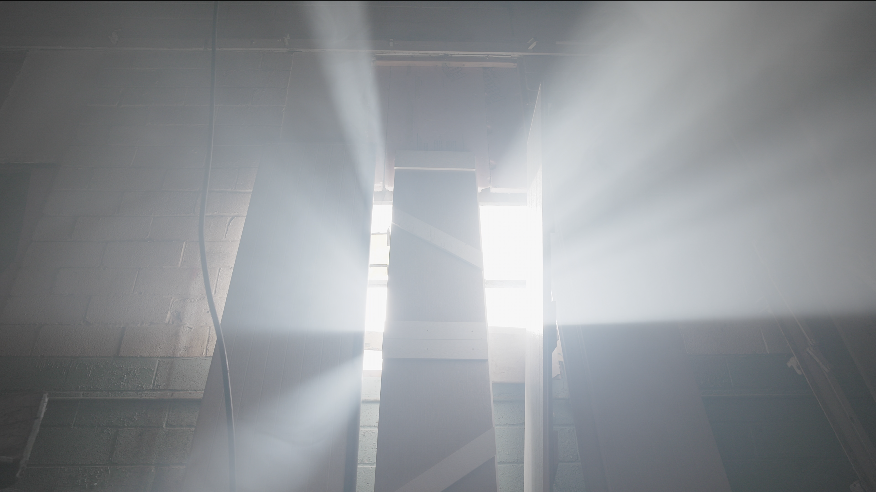 Light streaming through industrial structure