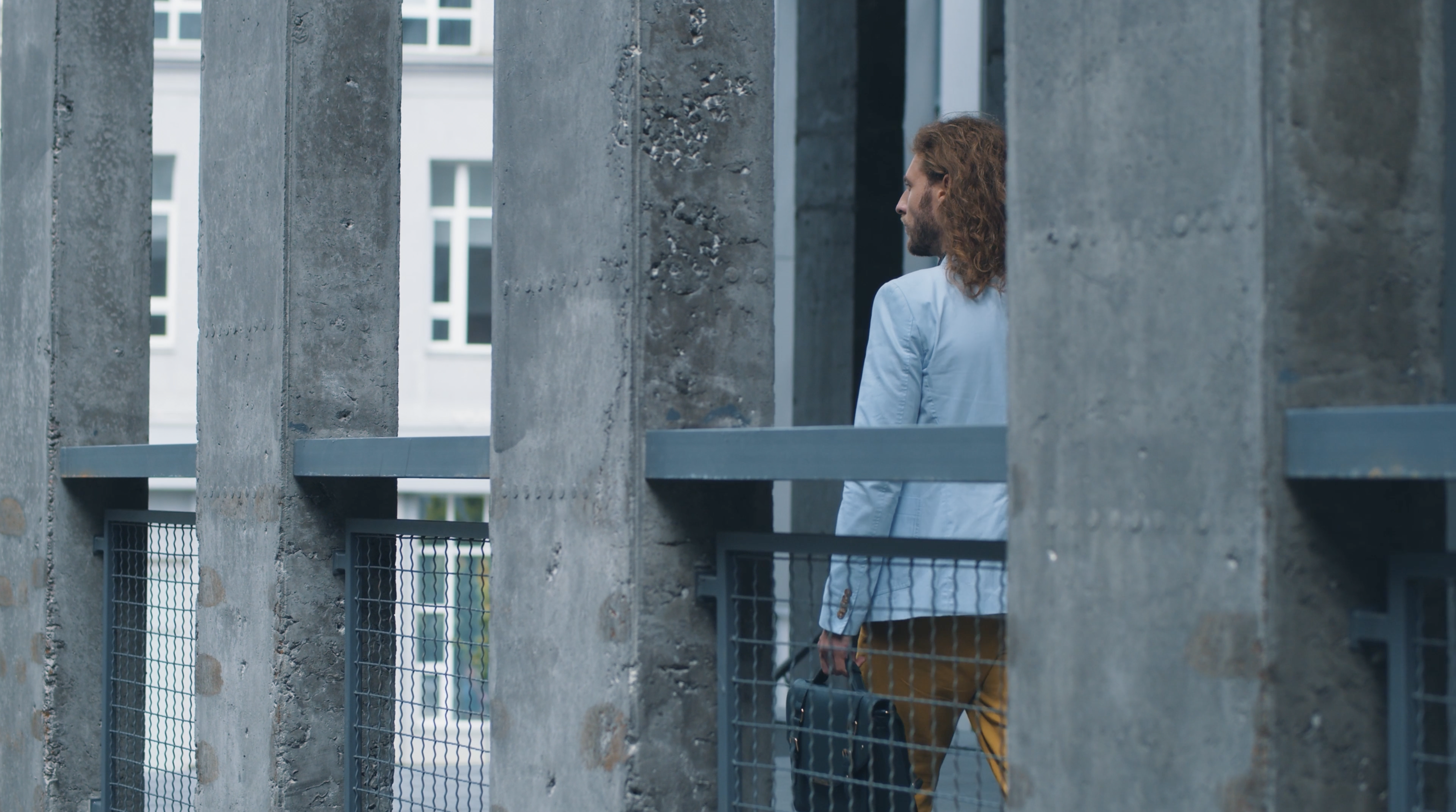 Person between concrete pillars